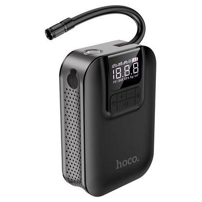 Hoco S53 portable smart air pump digital tire inflator with LED display and emergency light shown inflating a car tire in the UAE